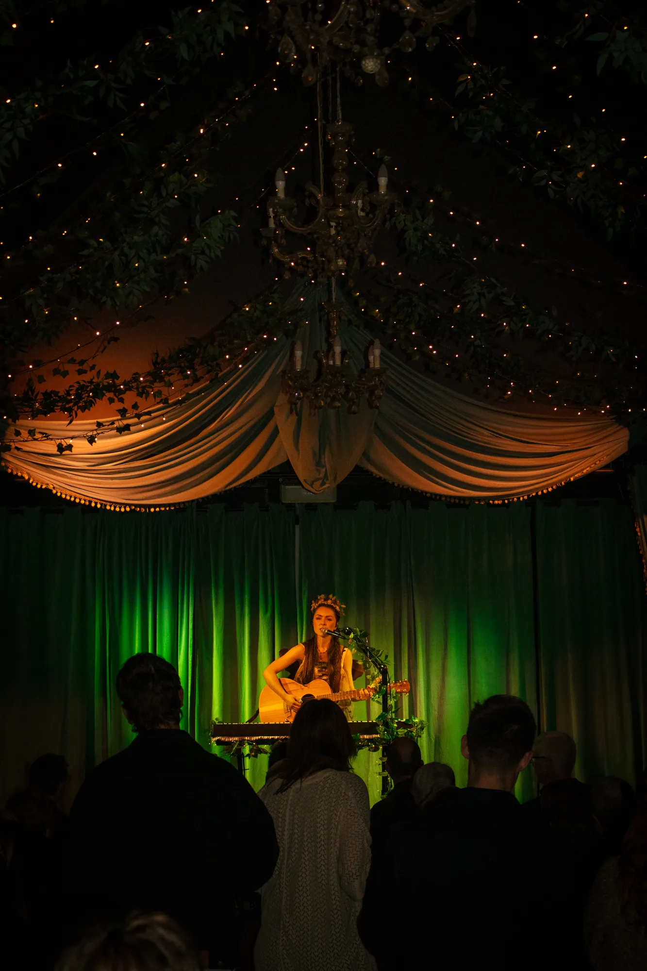 Solly Fern at the keyboard beneath a draped canopy and fairy lights at The Jade, Into Halves EP launch, July 2026