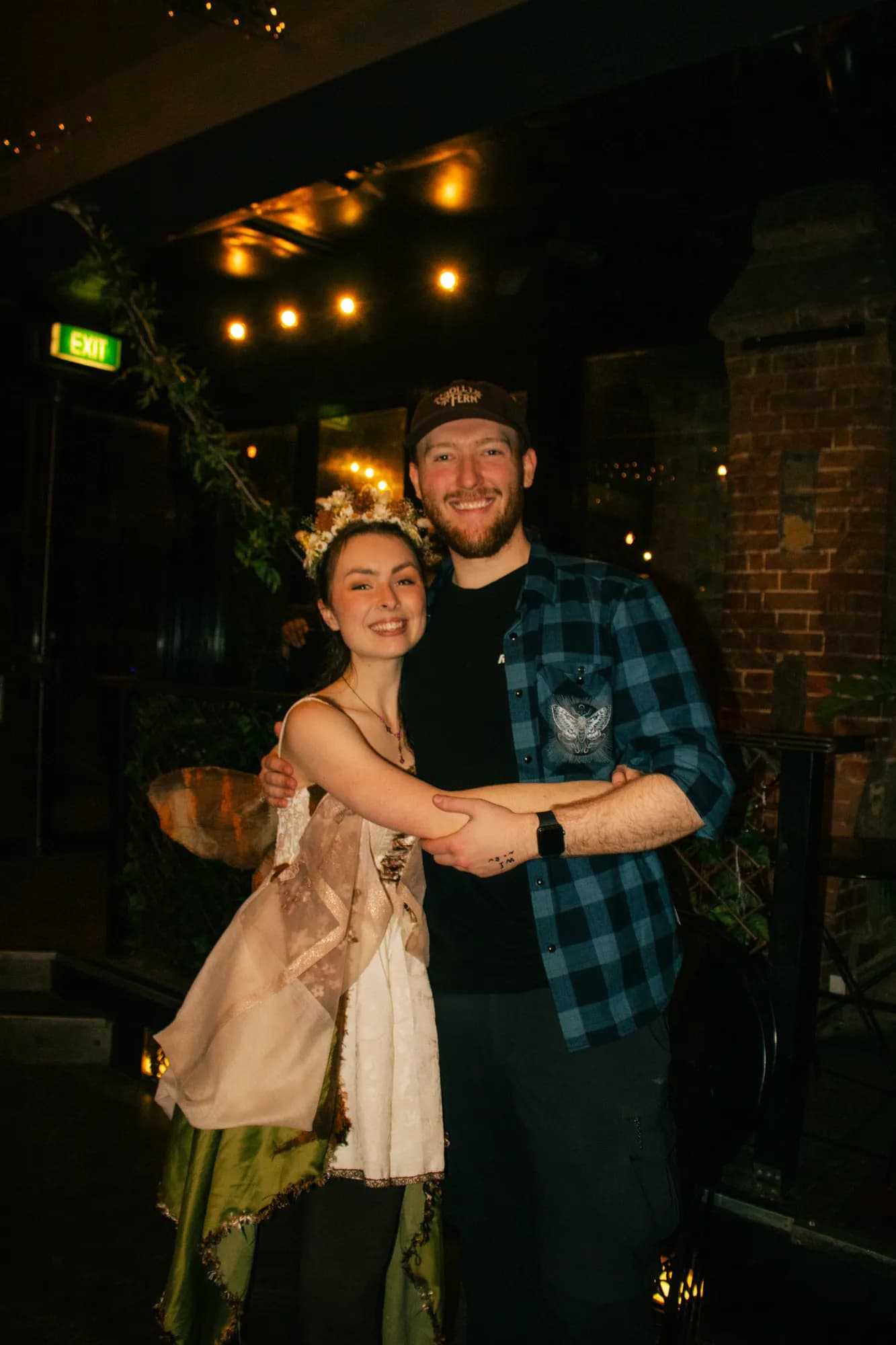 Solly Fern in a flower crown with Edward, who runs sound and lighting at her live shows